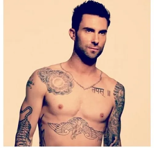 Adam Levine of Maroon 5 unveils new tattoo of mermaid clutching a skull   Daily Mail Online